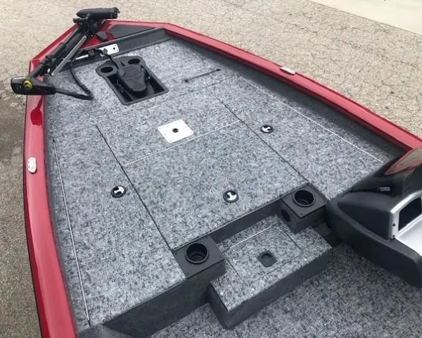Slide: The Image of 2025 Tracker Pro Team 175 TXW boat deck with gray carpet and red trim. - 8
