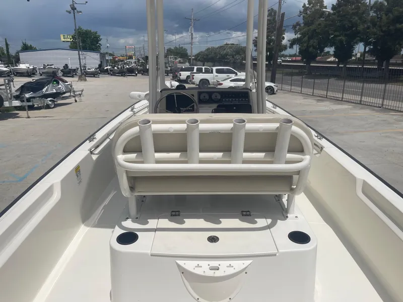 Slide: The Image of 2019 Boston Whaler 210 Montauk boat interior with rod holders and console. - 10