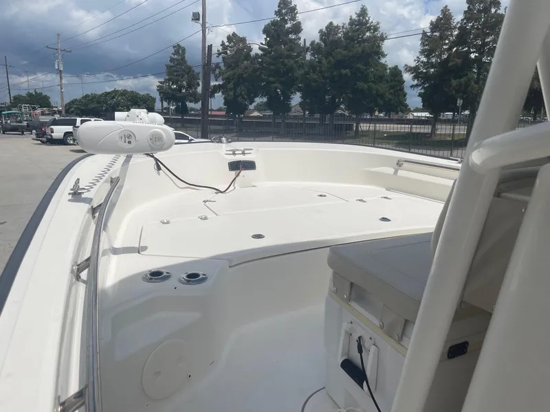 Slide: The Image of 2019 Boston Whaler 210 Montauk boat interior with seating and storage compartments. - 11