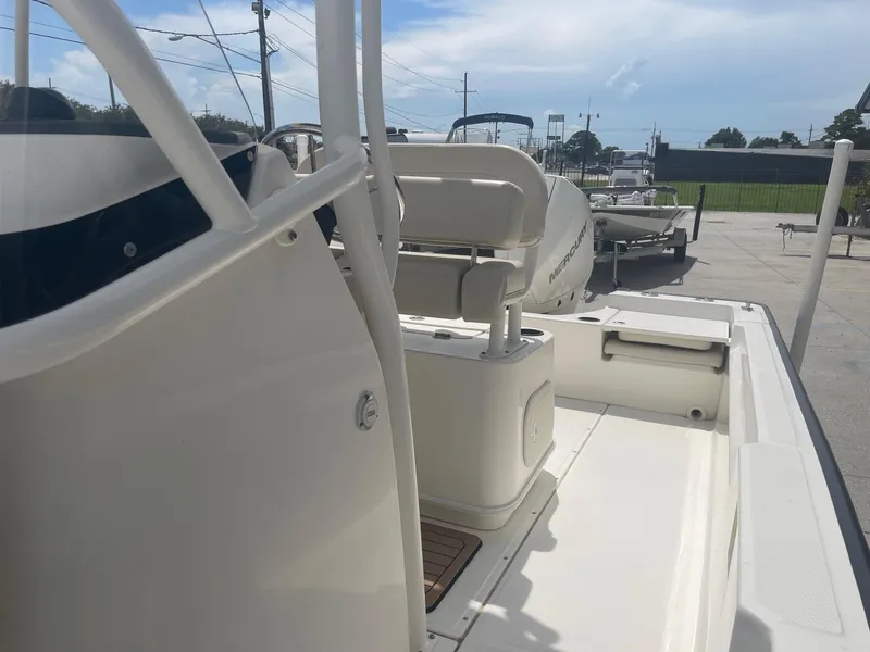 Slide: The Image of 2019 Boston Whaler 210 Montauk boat interior view with seating and deck. - 13