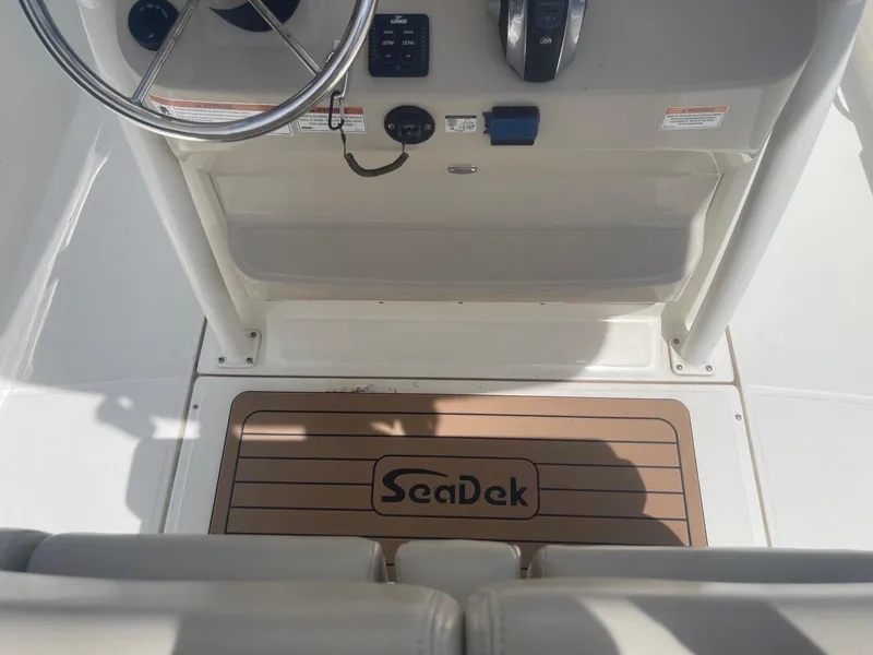 Slide: The Image of 2019 Boston Whaler 210 Montauk boat console with SeaDek flooring. - 17