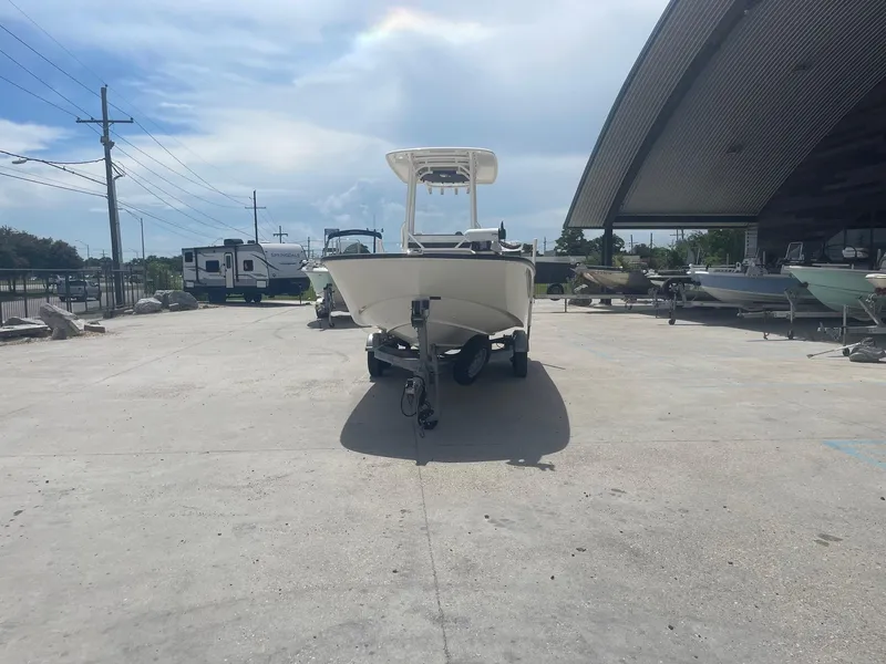 Slide: The Image of 2019 Boston Whaler 210 Montauk boat on trailer in outdoor storage area. - 2