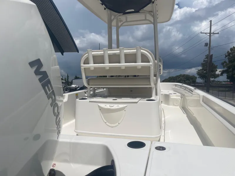 Slide: The Image of 2019 Boston Whaler 210 Montauk boat with Mercury engine, white interior, and center console. - 7