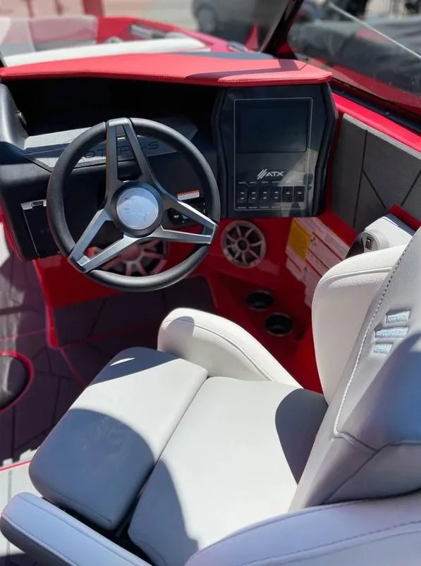 Slide: The Image of 2024 ATX 20 Type-S boat interior with steering wheel and touchscreen display. - 16