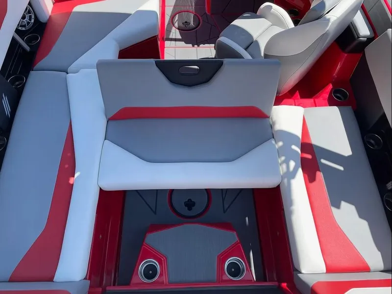 Slide: The Image of 2024 ATX 20 Type-S boat interior with red and gray seating and cup holders. - 20