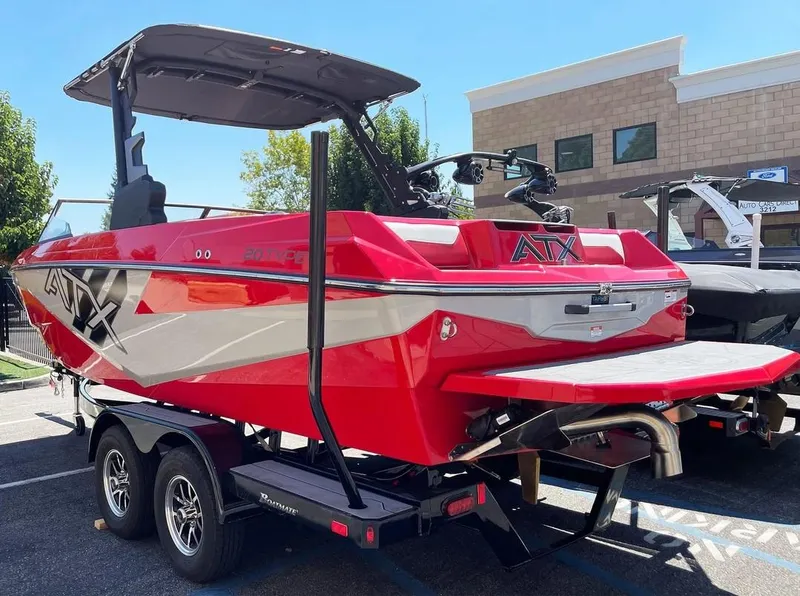 Slide: The Image of 2024 ATX 20 Type-S red and silver wakeboard boat on a trailer. - 4