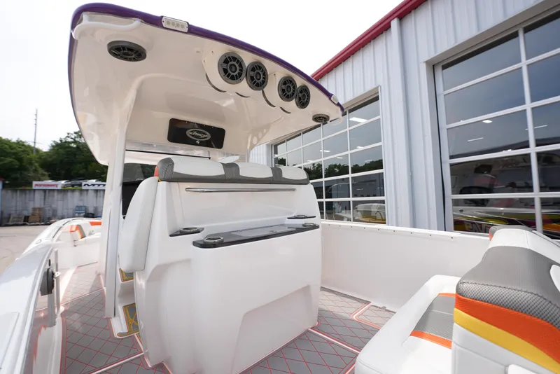Slide: The Image of 2014 Sunsation 34 CCX boat interior with seating and speakers. - 12