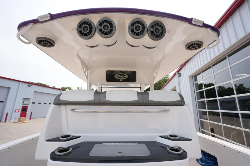 Slide: The Image of 2014 Sunsation 34 CCX boat with advanced audio system and sleek design. - 13