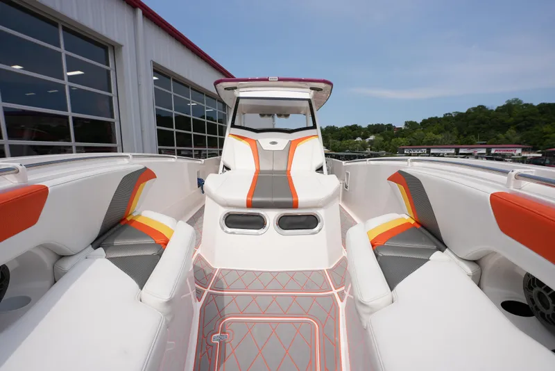 Slide: The Image of 2014 Sunsation 34 CCX boat interior with modern seating and vibrant accents. - 16