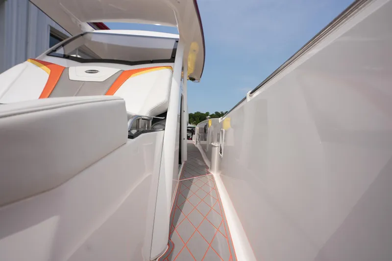 Slide: The Image of 2014 Sunsation 34 CCX boat interior with modern seating and sleek design. - 17
