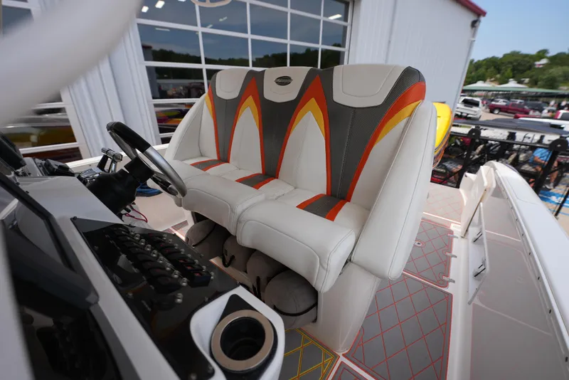 Slide: The Image of 2014 Sunsation 34 CCX boat cockpit with stylish seating and control panel. - 19