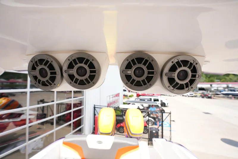 Slide: The Image of 2014 Sunsation 34 CCX boat with overhead speakers and colorful seats. - 23