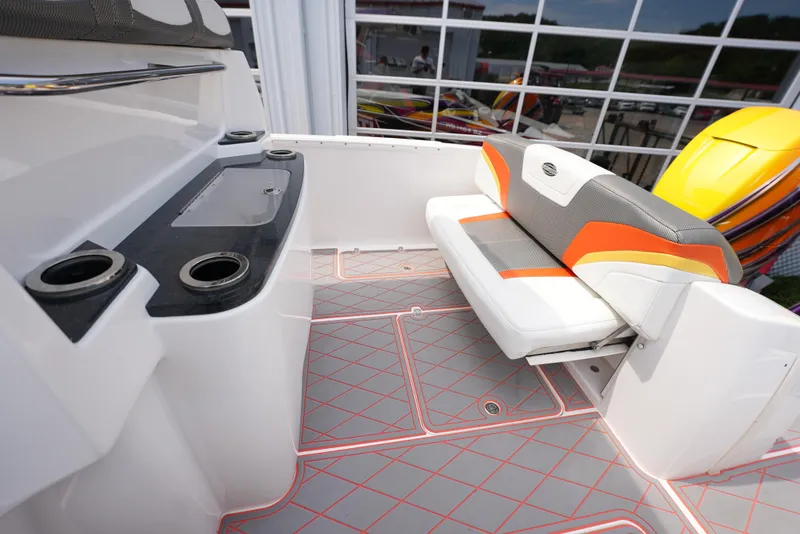 Slide: The Image of 2014 Sunsation 34 CCX boat interior with seating and storage compartments. - 24