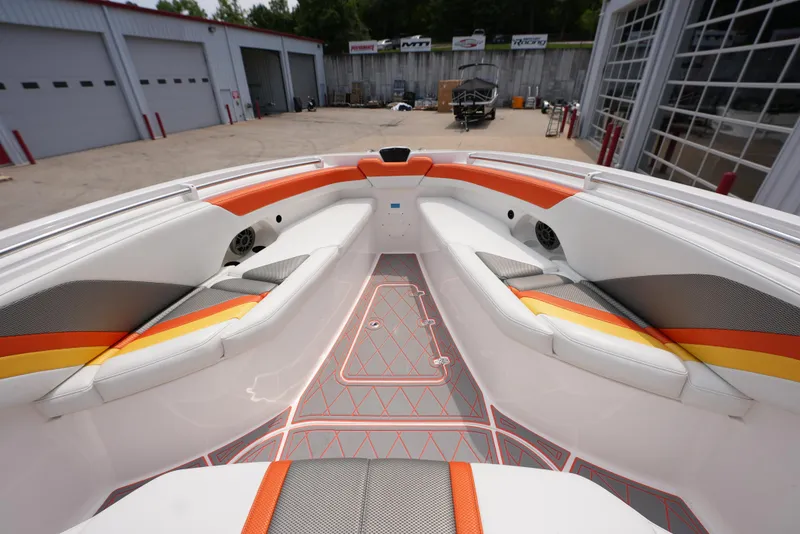 Slide: The Image of 2014 Sunsation 34 CCX boat interior with orange and white seating. - 26