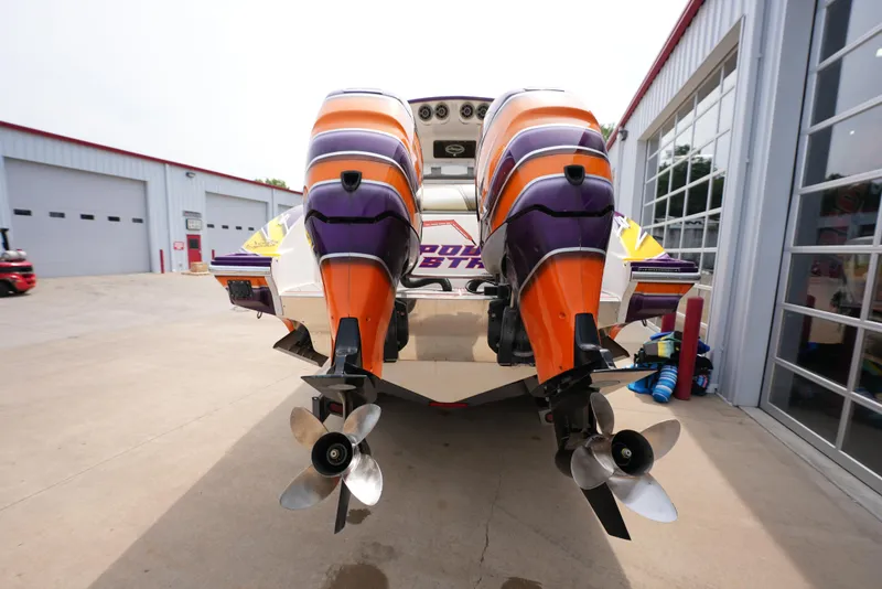 Slide: The Image of 2014 Sunsation 34 CCX boat with dual outboard motors in a marina. - 7