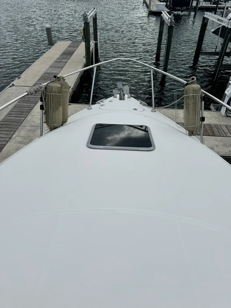 Slide: The Image of 2004 Chaparral Signature 260 boat docked at a marina. - 10