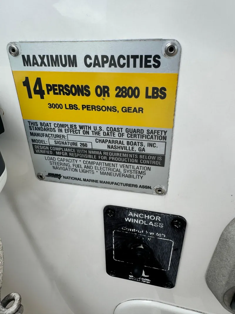 Slide: The Image of 2004 Chaparral Signature 260 capacity plate, 14 persons or 2800 lbs, anchor windlass control. - 11