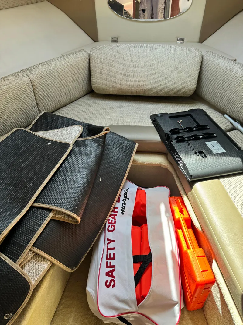 Slide: The Image of Interior of 2004 Chaparral Signature 260 with safety gear and accessories. - 13