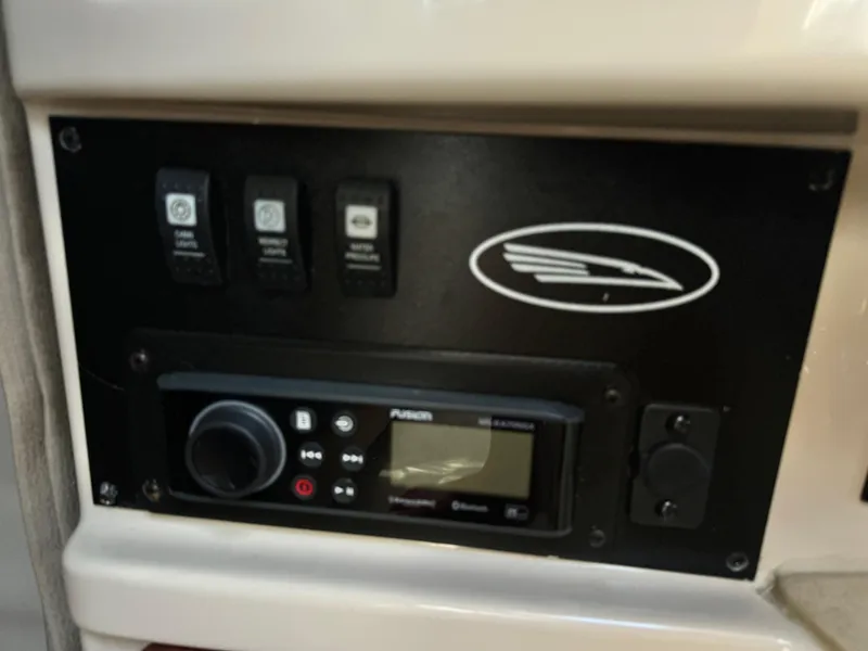 Slide: The Image of Control panel of a 2004 Chaparral Signature 260 boat with Fusion audio system. - 17
