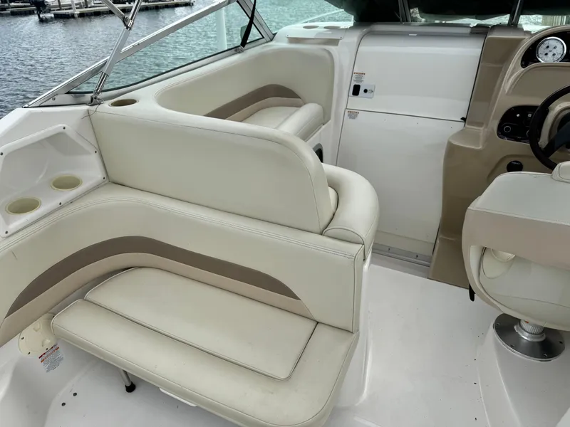 Slide: The Image of Interior seating of a 2004 Chaparral Signature 260 boat with beige upholstery. - 4