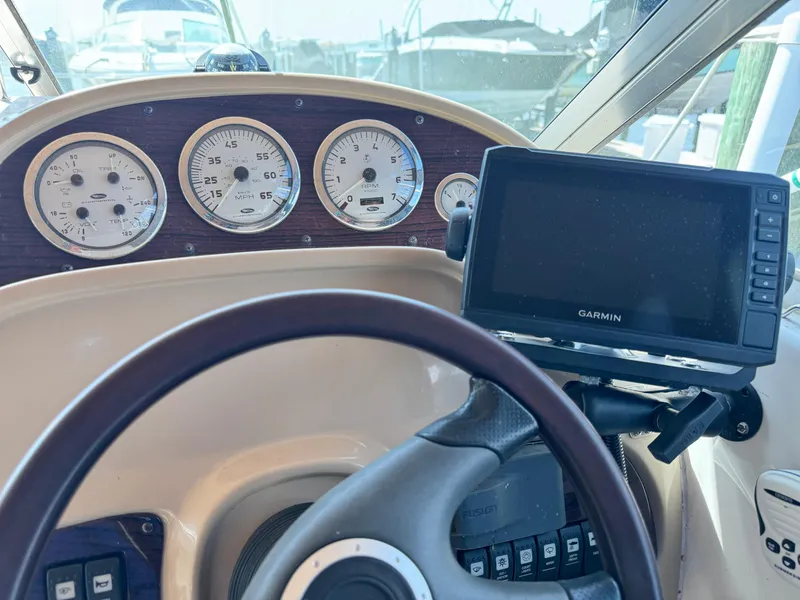 Slide: The Image of 2004 Chaparral Signature 260 dashboard with Garmin GPS and gauges. - 8
