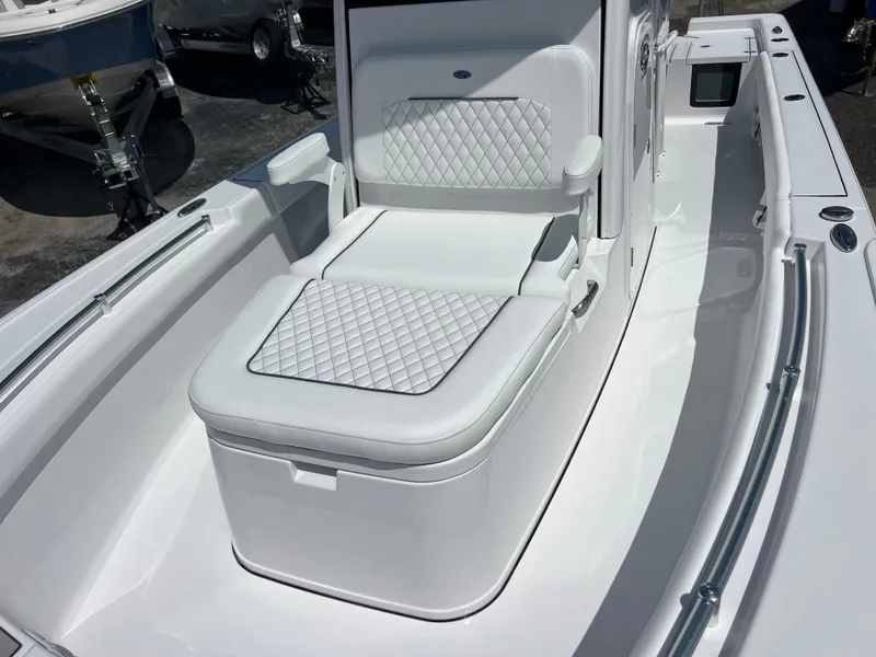Slide: The Image of 2024 Sportsman Masters 247OE Bay Boat with cushioned seating and storage. - 10