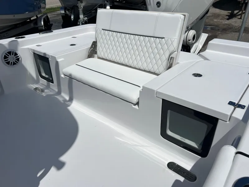 Slide: The Image of 2024 Sportsman Masters 247OE Bay Boat interior seating and storage compartments. - 13