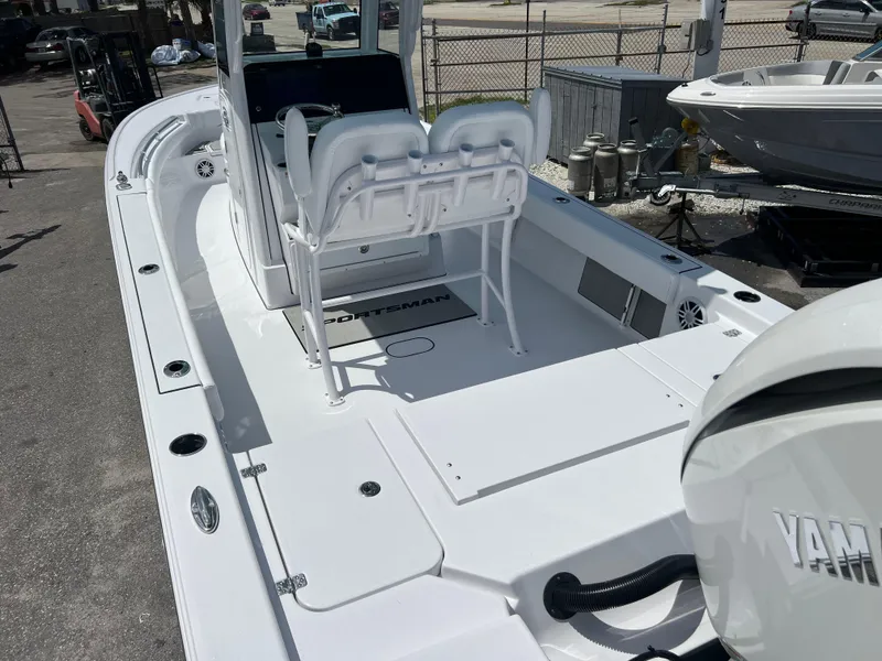 Slide: The Image of 2024 Sportsman Masters 247OE Bay Boat with Yamaha engine, spacious deck, and dual seating. - 4