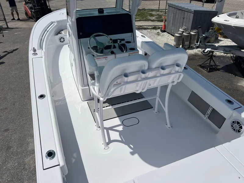 Slide: The Image of 2024 Sportsman Masters 247OE Bay Boat, white interior, center console, docked. - 5