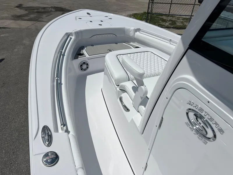 Slide: The Image of 2024 Sportsman Masters 247OE Bay Boat, white interior, bow seating area. - 8