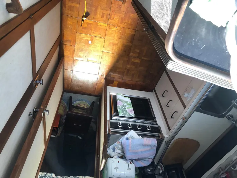 Slide: The Image of Interior of 1983 Carver 32 Aft Cabin with kitchen and dining area. - 6