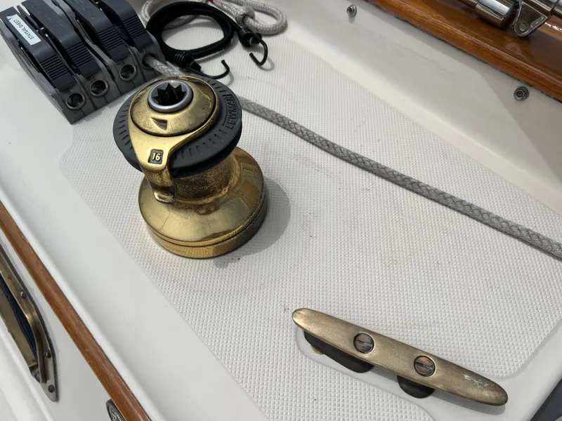 Slide: The Image of Pacific Seacraft 34 sailboat deck, 1994 model, featuring winch and cleat. - 12