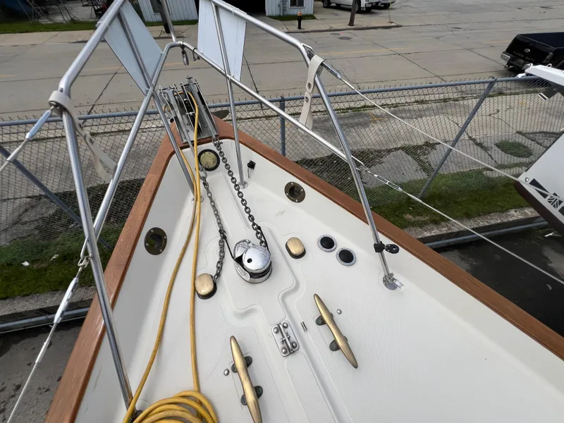 Slide: The Image of Bow of 1994 Pacific Seacraft 34 sailboat with anchor chain and deck fittings. - 15