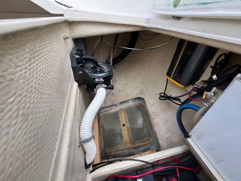 Slide: The Image of Interior of a 1994 Pacific Seacraft 34 sailboat showing bilge pump and wiring. - 32