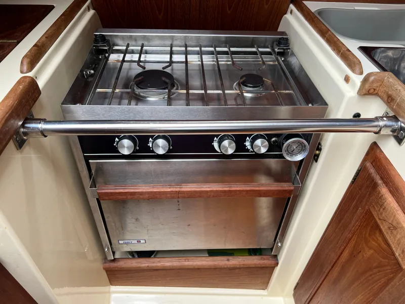Slide: The Image of Stainless steel stove and oven in 1994 Pacific Seacraft 34 sailboat galley. - 36