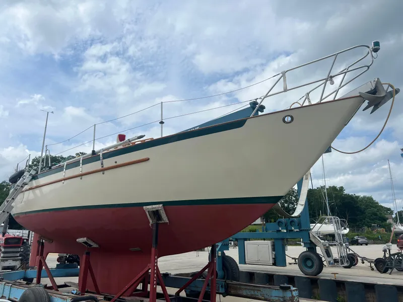 Slide: The Image of 1994 Pacific Seacraft 34 sailboat on dry dock for maintenance. - 5