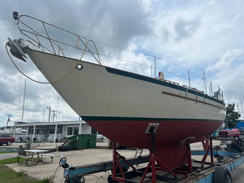 Slide: The Image of 1994 Pacific Seacraft 34 sailboat on a trailer at a marina. - 6