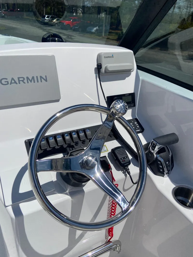 Slide: The Image of 2024 Aquasport 2200 Dual Console boat helm with Garmin navigation system. - 4