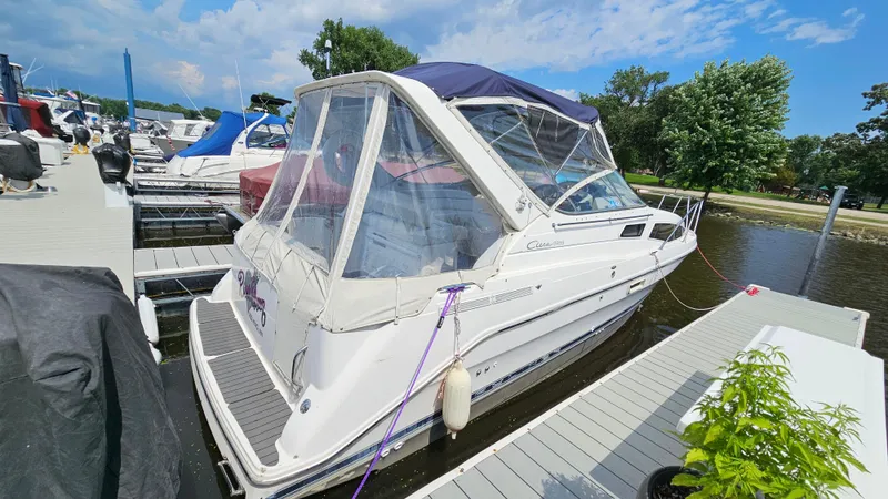 The Image of 1998 Bayliner 2855 Ciera docked at a marina on a sunny day. - 1