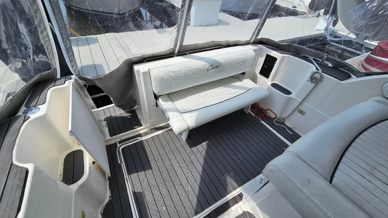 Slide: The Image of 1998 Bayliner 2855 Ciera boat interior with seating and deck area. - 10