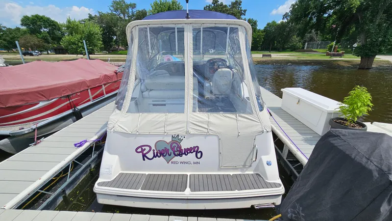 Slide: The Image of 1998 Bayliner 2855 Ciera docked, rear view with River Queen text. - 4