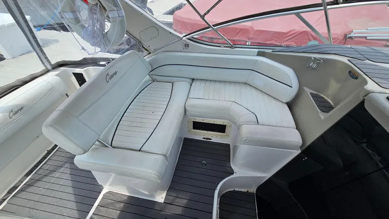 Slide: The Image of 1998 Bayliner 2855 Ciera boat interior with white cushioned seating. - 7