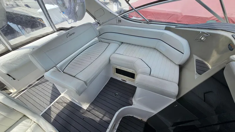 Slide: The Image of 1998 Bayliner 2855 Ciera boat interior with white cushioned seating. - 8