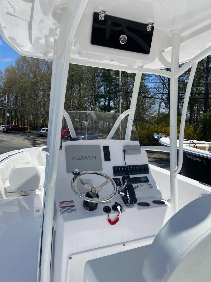 Slide: The Image of 2024 Aquasport 2400CS boat console with Garmin navigation system. - 3