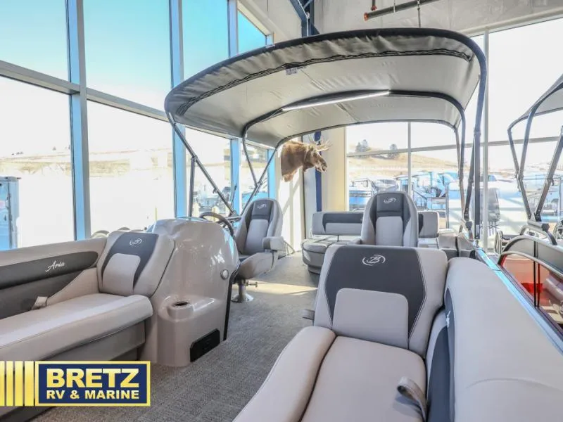 Slide: The Image of 2025 Aria A22CC pontoon boat interior at Bretz RV & Marine showroom. - 7