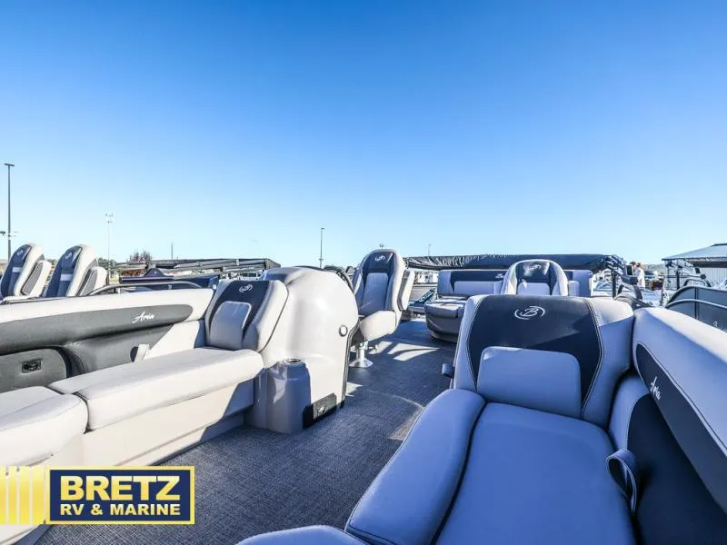 Slide: The Image of 2025 Aria Ultra-Lounge A22UC boat interior with plush seating under clear blue sky. - 14