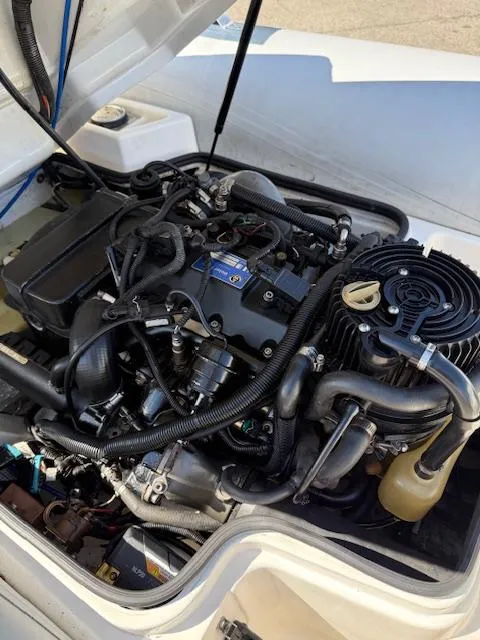 Slide: The Image of 2011 Williams Jet Tenders Turbojet 325 engine compartment with visible components and wiring. - 11