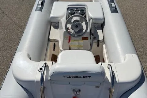 Slide: The Image of 2011 Williams Jet Tenders Turbojet 325, white interior, steering console view. - 14