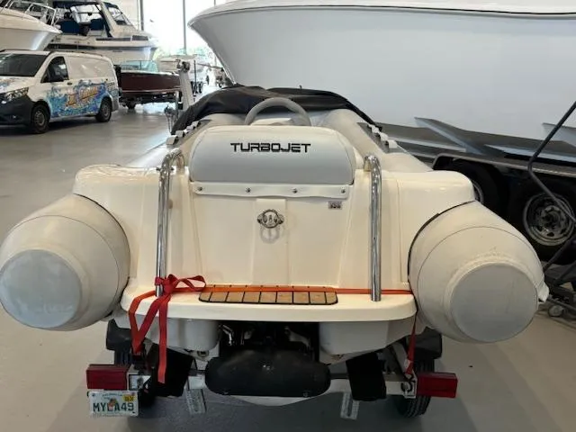 Slide: The Image of 2011 Williams Jet Tenders Turbojet 325 on trailer in a boat storage facility. - 3