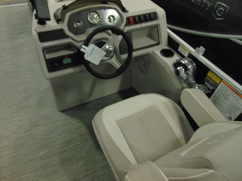Slide: The Image of 2024 Godfrey Xperience 1880 FX 25 in. Package boat cockpit with steering wheel and controls. - 12